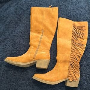 Tan tall boots with fringe